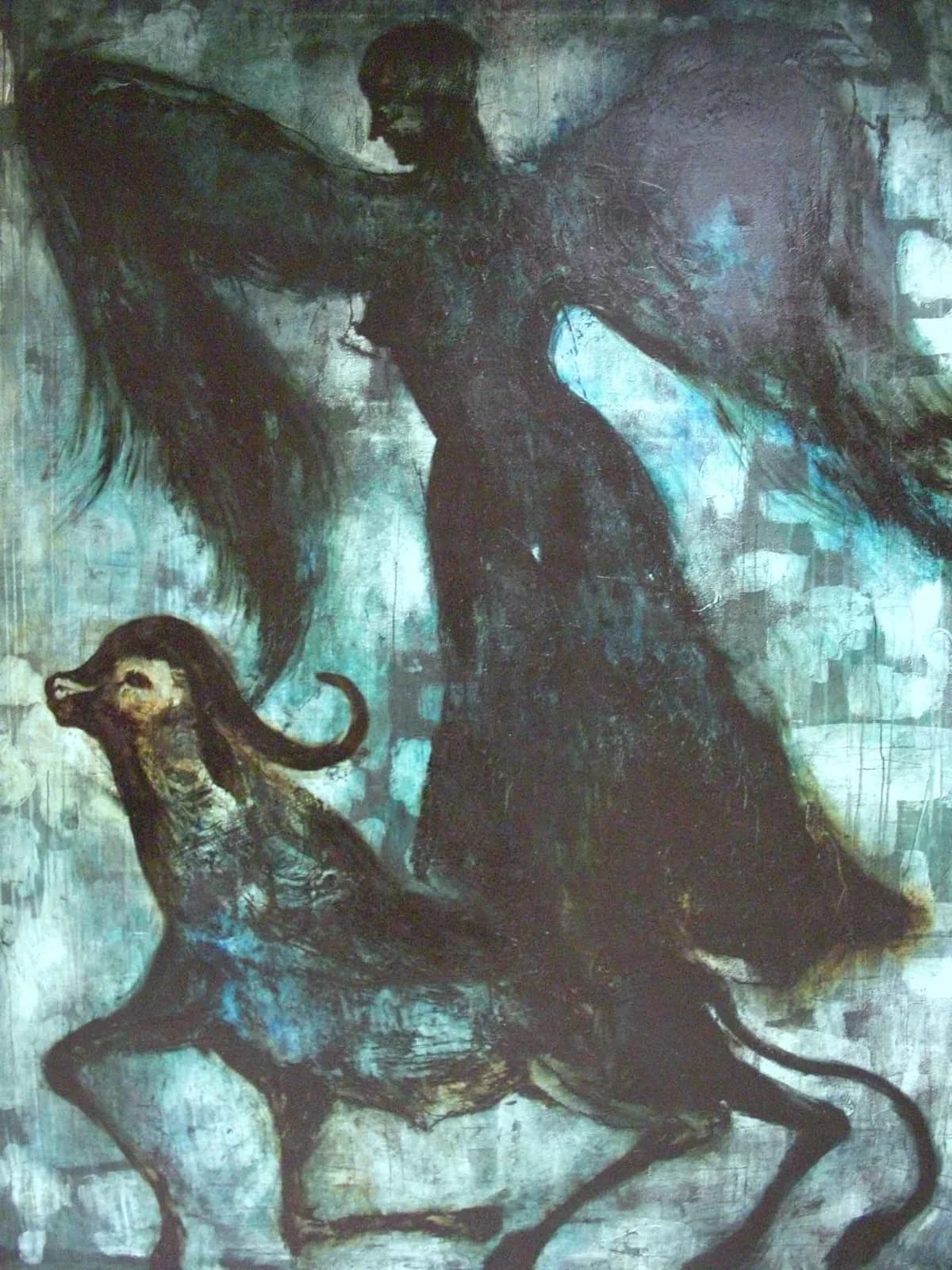 Mexican artist Guillermo Olguín surrounded by expressive paintings inspired by Oaxaca, travel, mythology and memory